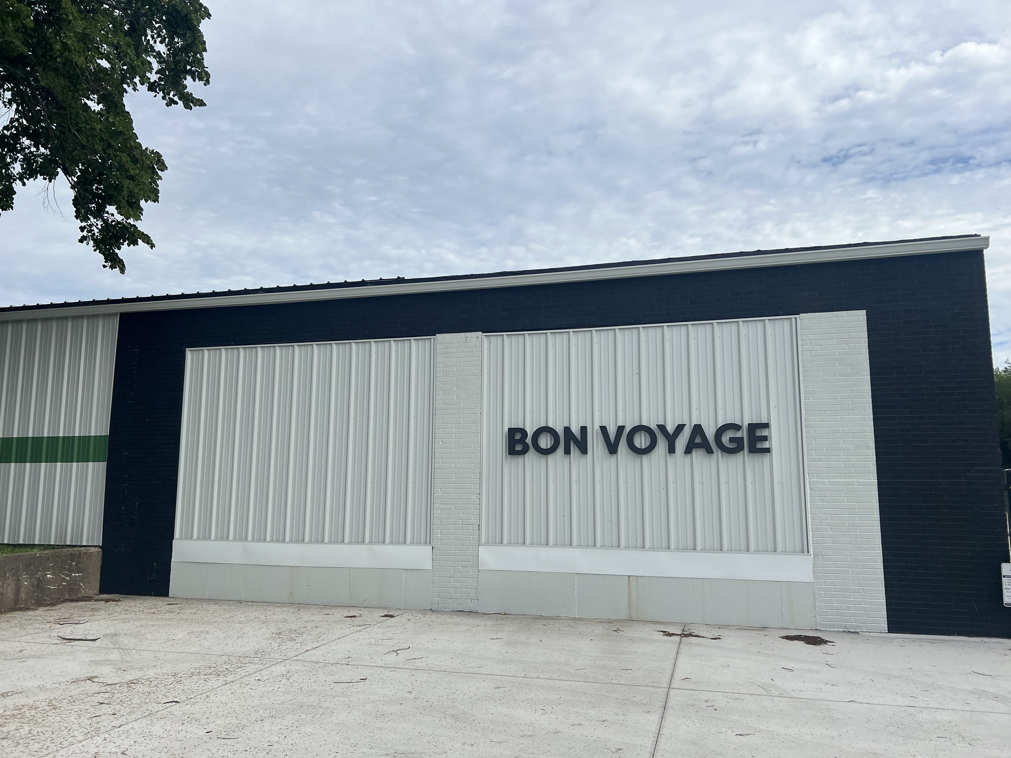 White side of building that says "BON VOYAGE" to name the boat and RV storage facility